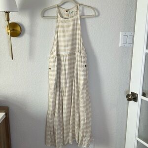 Linen dress. It’s lined and has pockets and snap buttons. Urban Outfitters.